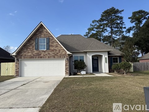 A house with a brick exterior and a white garage door.