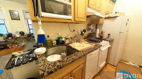A kitchen with a stove, microwave, and dishwasher.