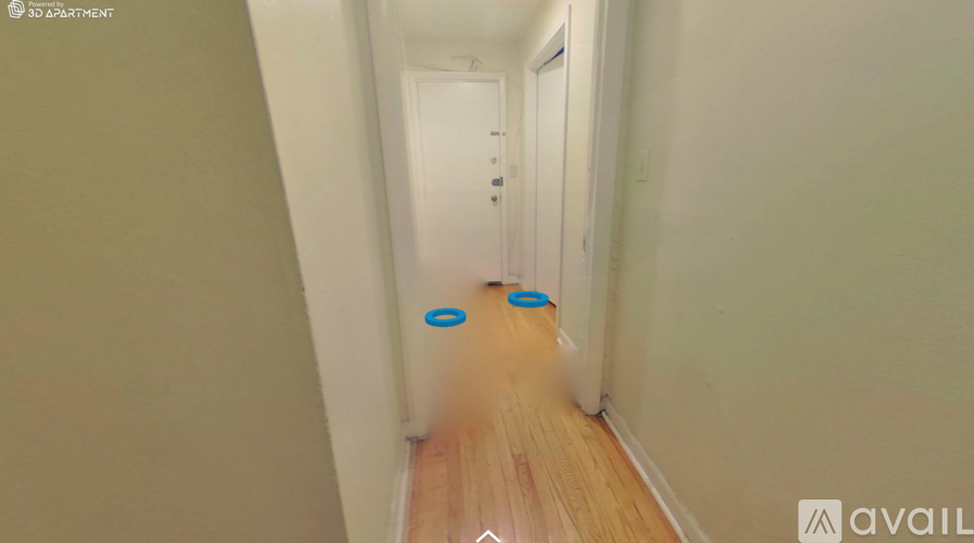 A hallway with a blue circle on the floor.