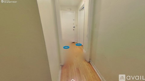 A hallway with a blue circle on the floor.