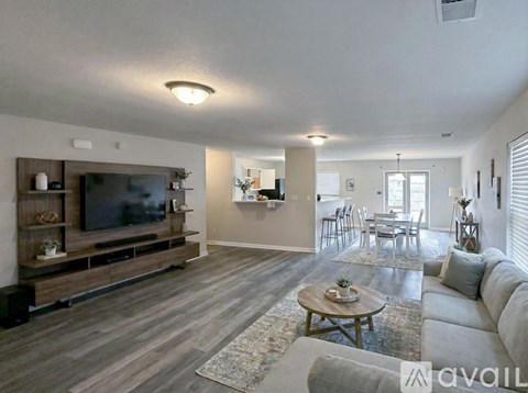 A living room with a television and a coffee table.
