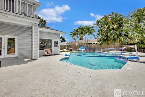 A house with a pool in the backyard.