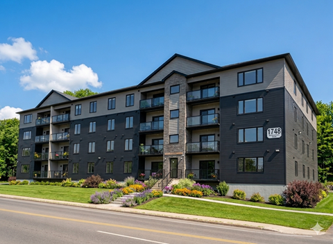 A modern apartment building with the number 1748 on the front.