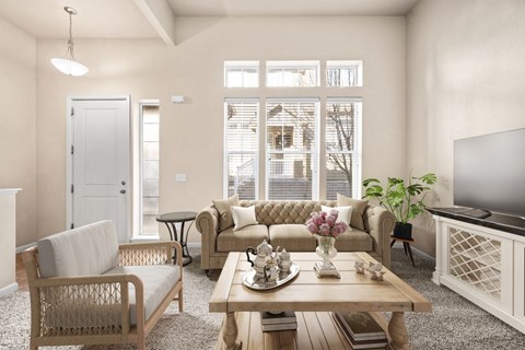 A living room with a sofa, armchair, and coffee table.