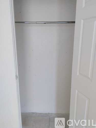 A white door with a white interior and a white wall.