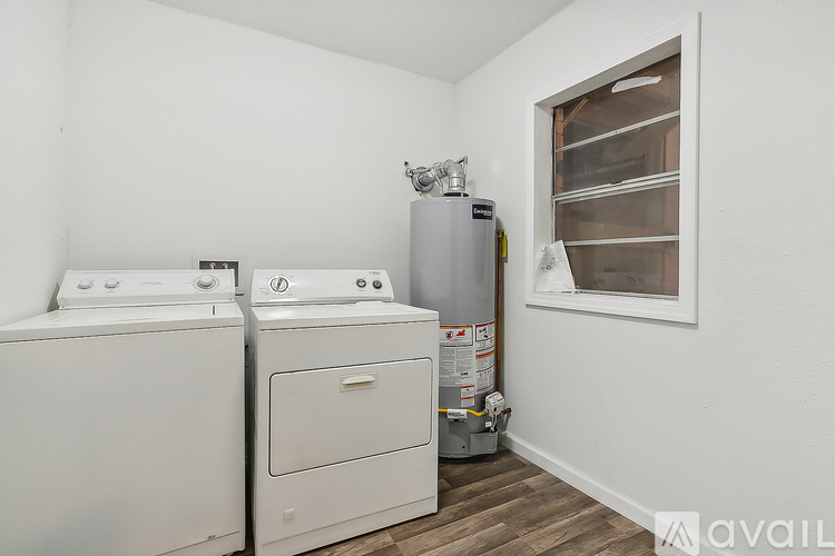 A laundry room with a washer and dryer.