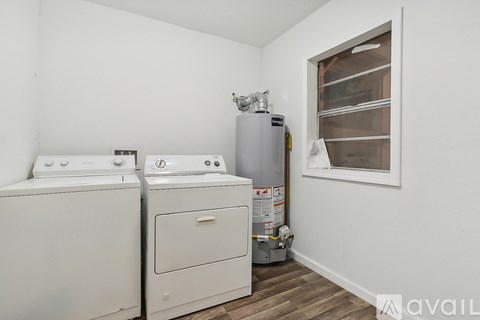 A laundry room with a washer and dryer.
