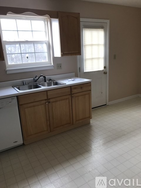 A kitchen with a washer and dryer built in.
