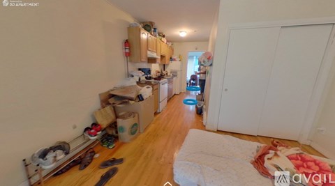 A kitchen area with a white fridge, a white dishwasher, a white washing machine, a white oven, a white toaster, a white microwave, a white sink, a white counter, a white cup