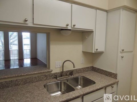 A kitchen with a sink and cabinets.