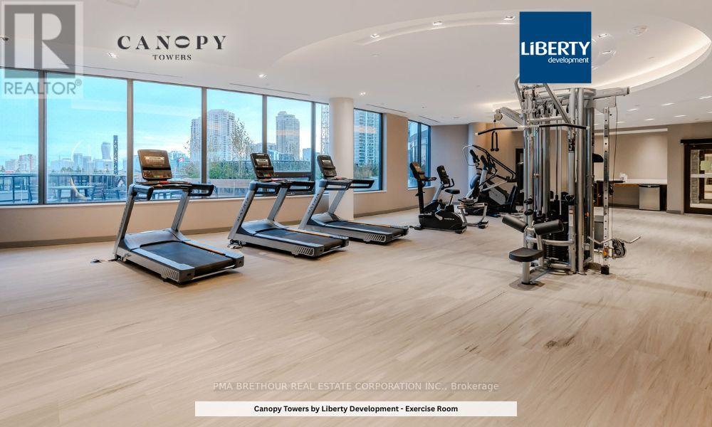 A gym with treadmills and exercise equipment in a Canopy Towers office.