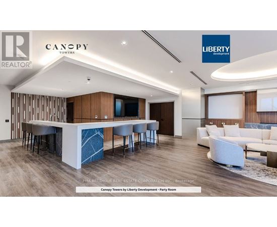 A modern living room with a bar area and a couch.