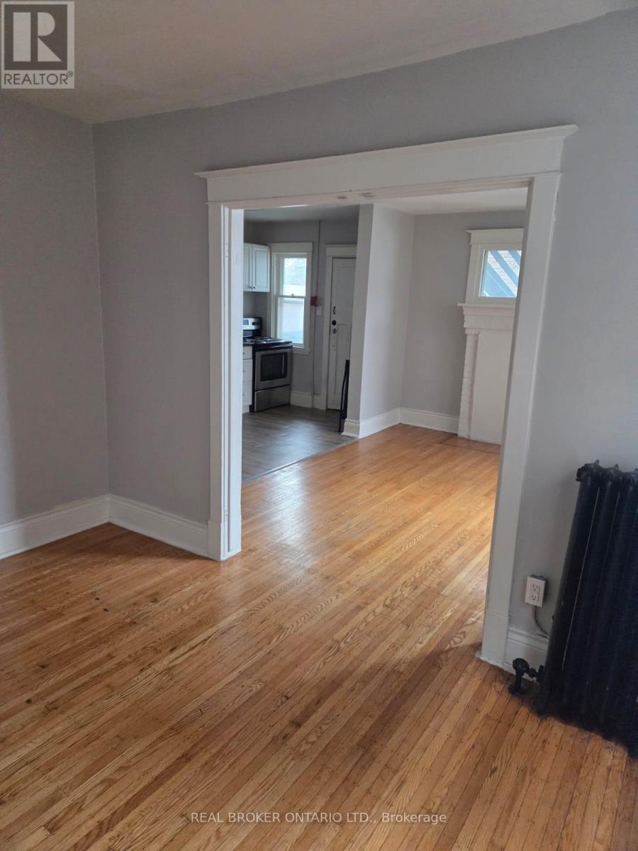 A room with wooden floors and white walls.