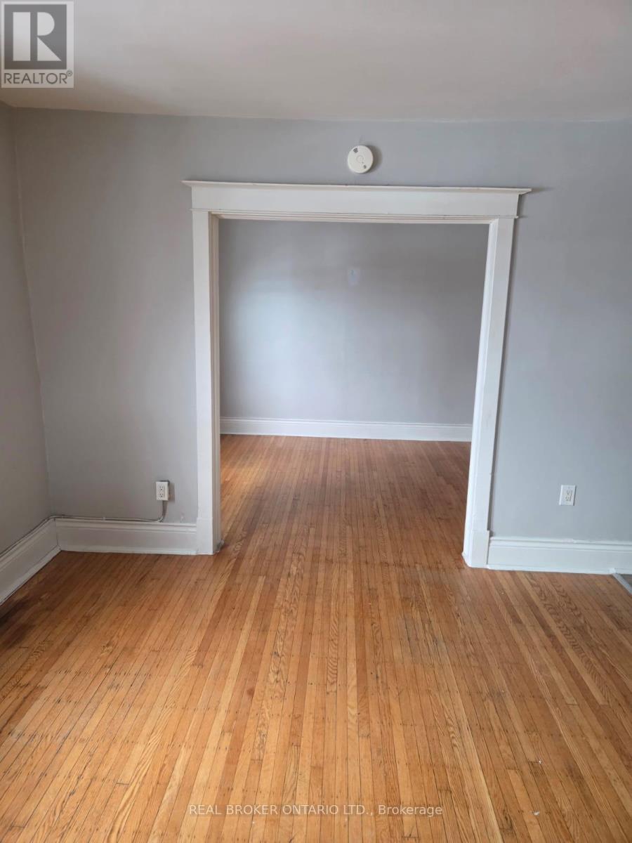 A room with wooden floors and white walls.