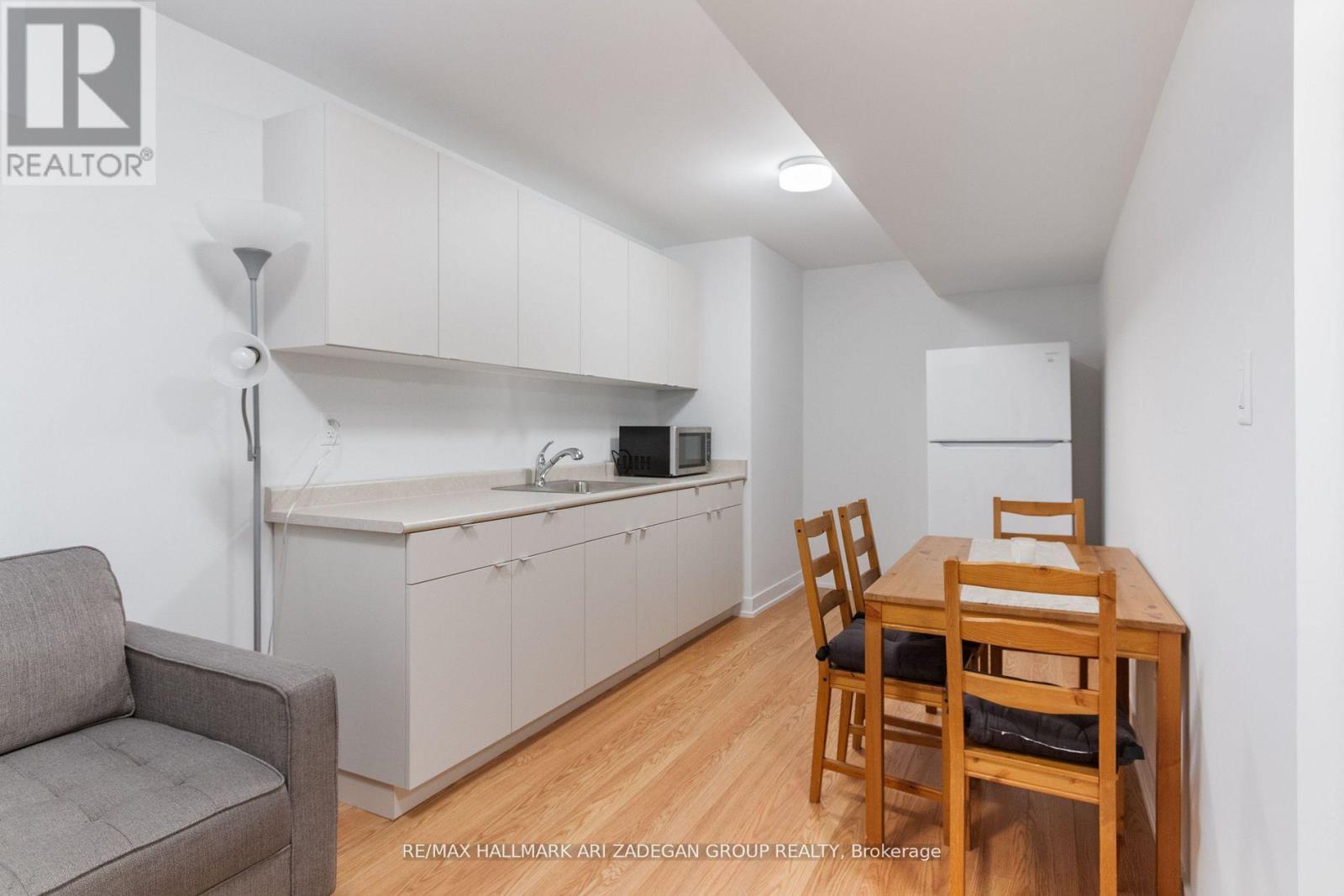 A small kitchen with a table and chairs.