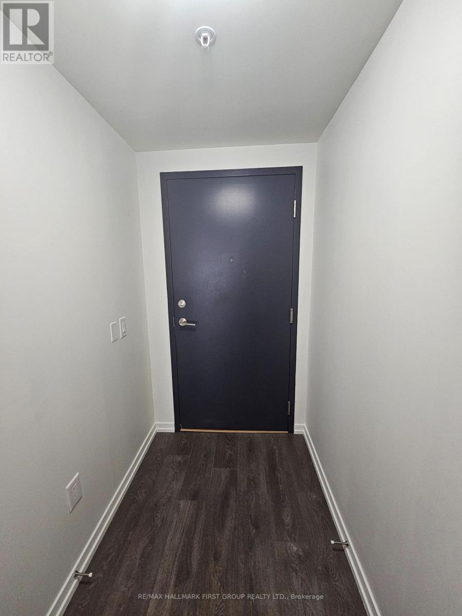 A white door with a black handle and lock.