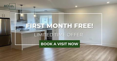 A kitchen with a refrigerator, stove, and oven is on sale for the first month free.