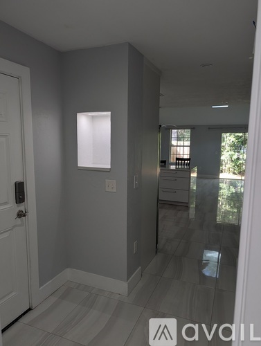 A room with a door and a window.