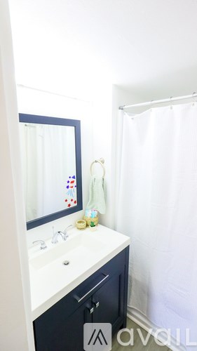 A bathroom with a sink and mirror.