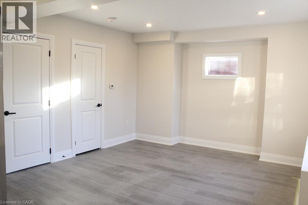 A room with a grey floor and white walls.
