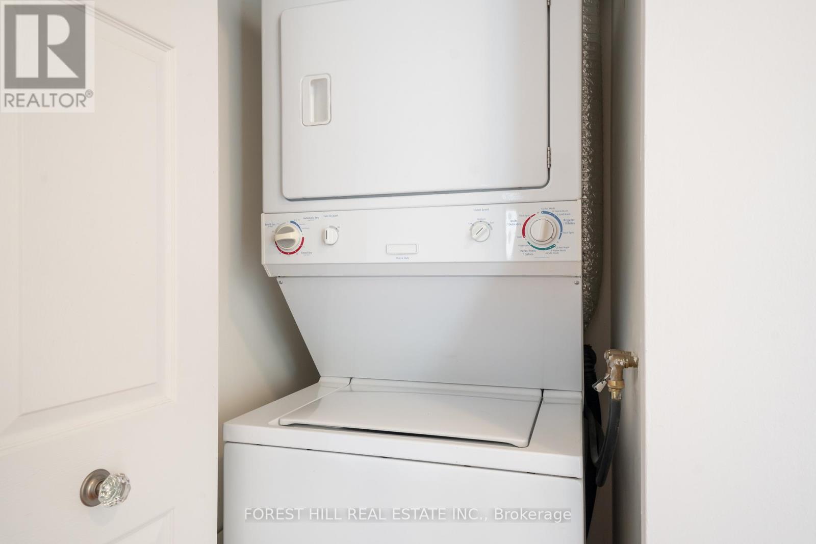 A white washing machine in a small space.
