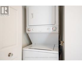 A white washing machine in a small space.