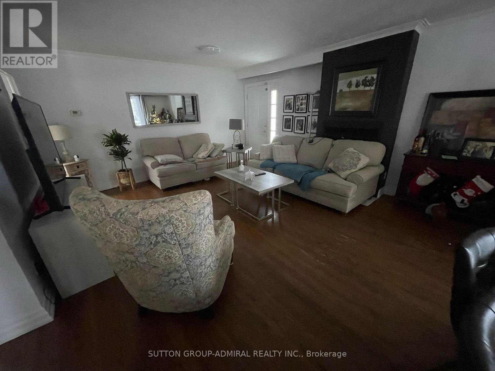 A living room with a couch, chair, and a coffee table.