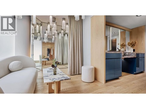 A modern living room with a white sofa and a wooden coffee table.