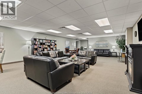 A living room with a grey couch and a coffee table.