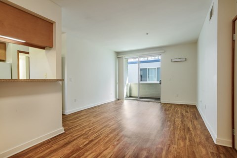 A room with wooden floors and white walls.