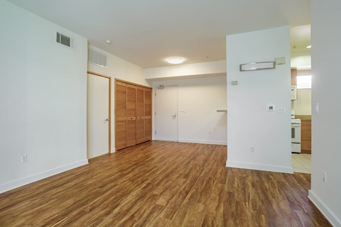 A room with wooden floors and white walls.