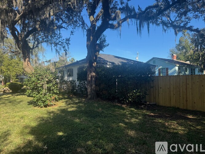 A house with a tree in front of it.