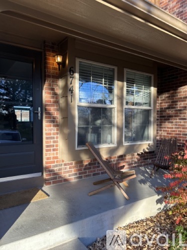 A house number 6747 is visible on the wall.
