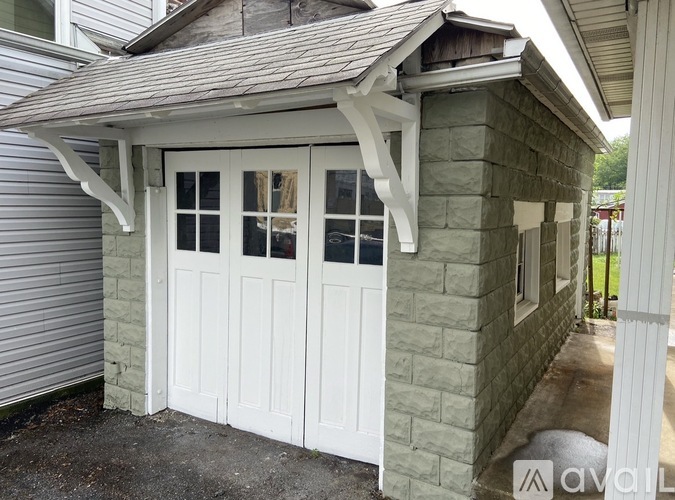 A white garage door is closed.