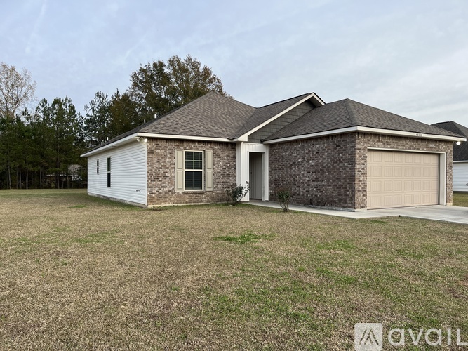 A house with a garage is for sale.