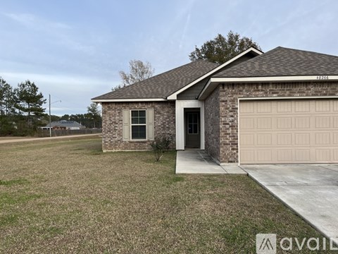 A house with a garage is available for sale.