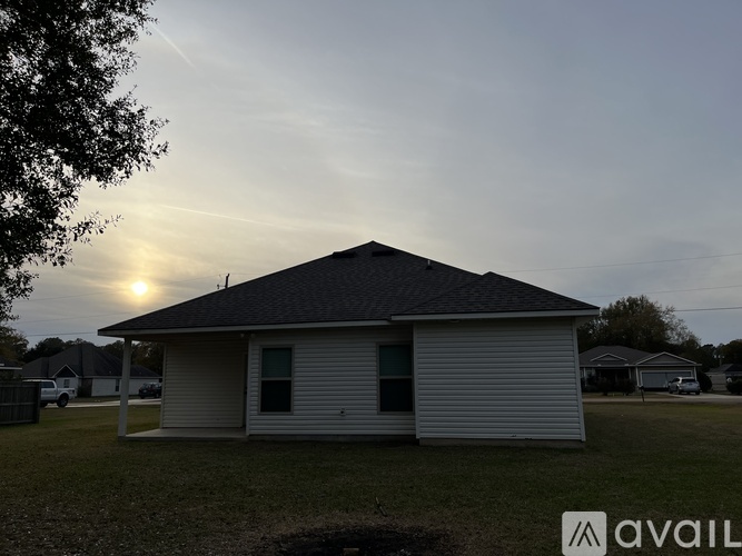 A house with a sunset in the background.