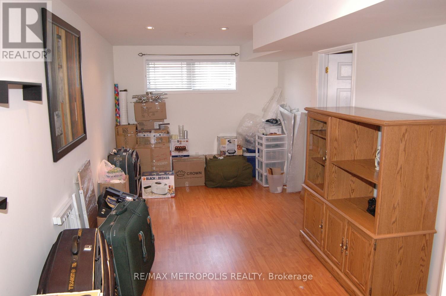 A room with a lot of boxes and items scattered around.