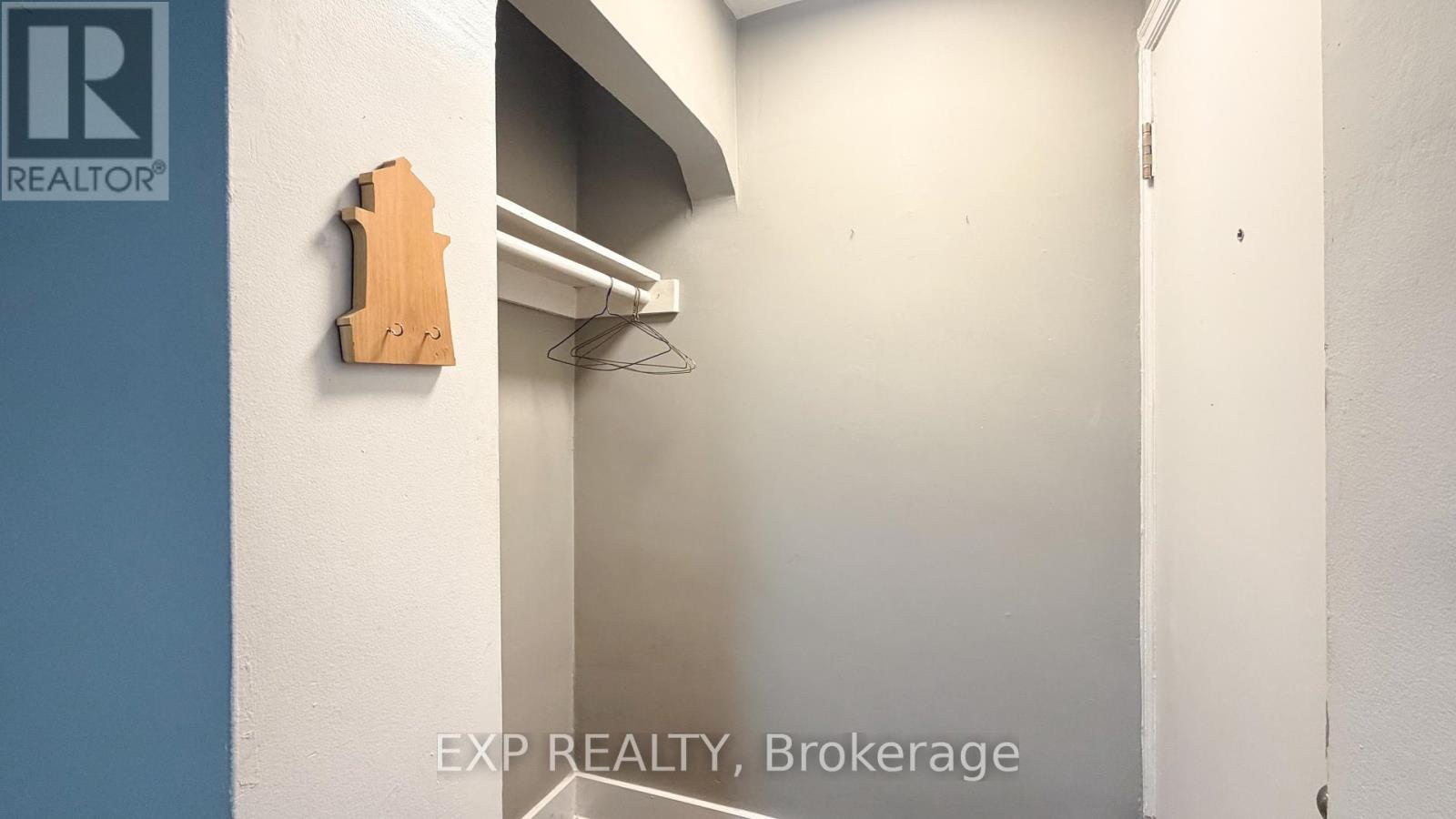 A brokerage office with a wooden sign on the wall.