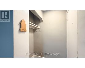 A brokerage office with a wooden sign on the wall.