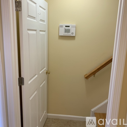 A room with two windows and carpeted floor.