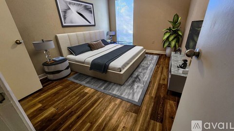 A bedroom with a bed, nightstand, and lamp.