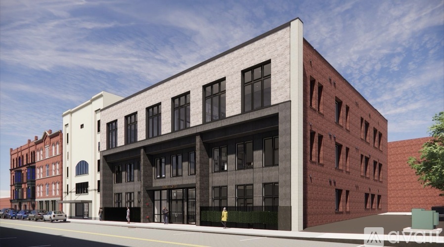 A modern building with a white and black facade is depicted in the image.