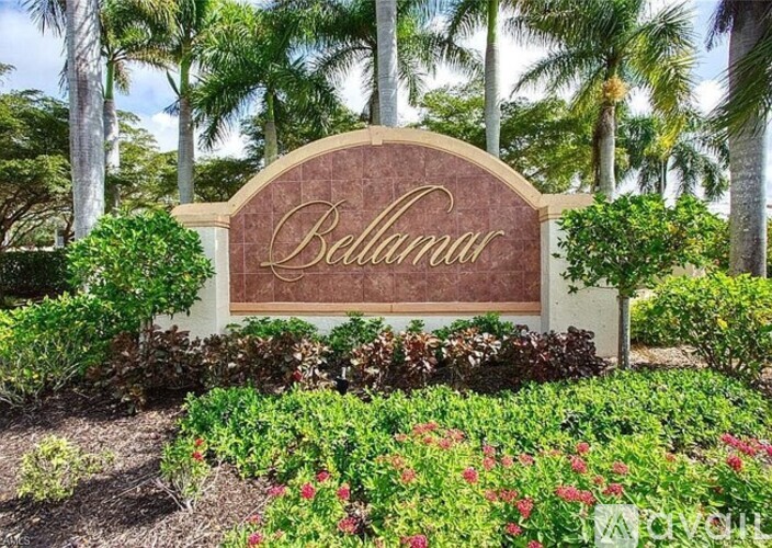 A garden sign that says Bellariva in front of some trees.