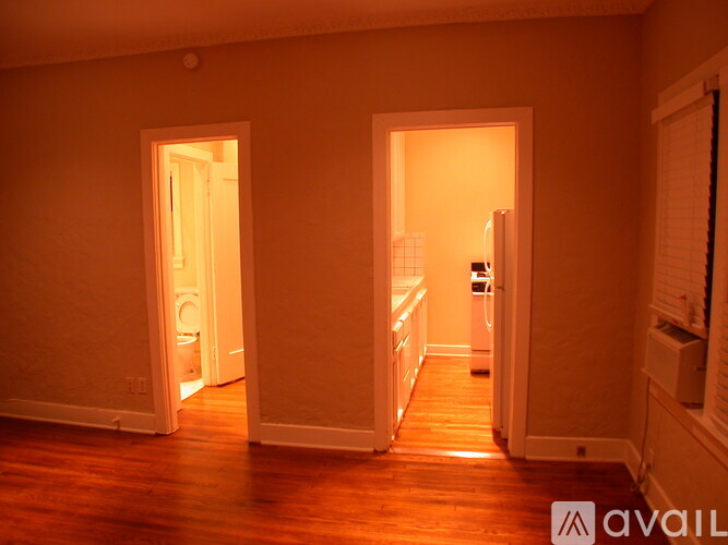 A room with two open doors leading to other rooms.
