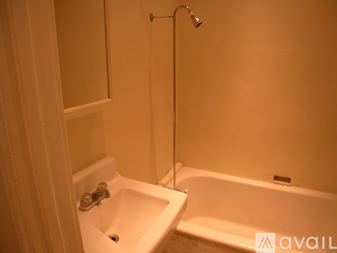 A bathroom with a sink, tub, and shower.