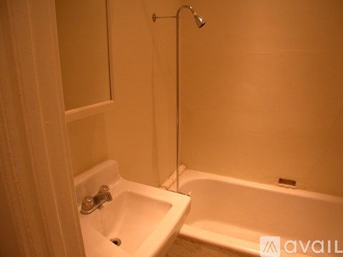 A bathroom with a sink, tub, and shower.