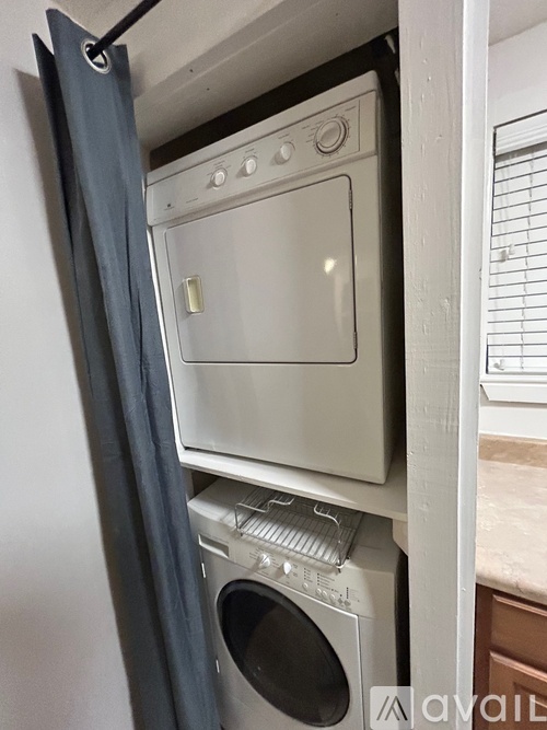 A white oven and dishwasher are installed in a kitchen.