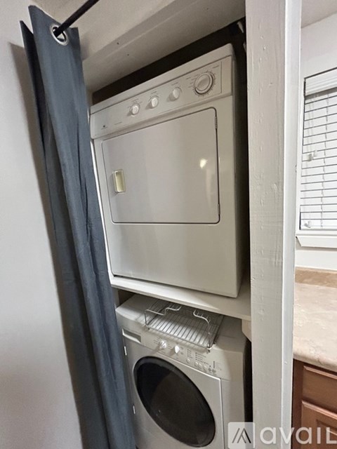 A white oven and dishwasher are installed in a kitchen.