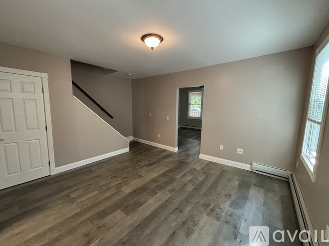 A house with a porch and a chimney is for sale.